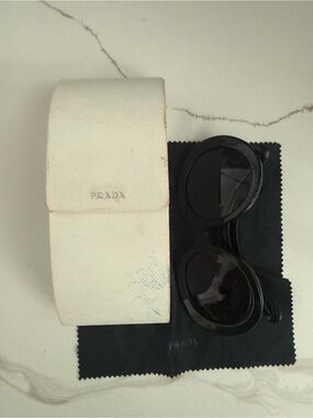 Prada Black Round Sunglasses with Cream Case